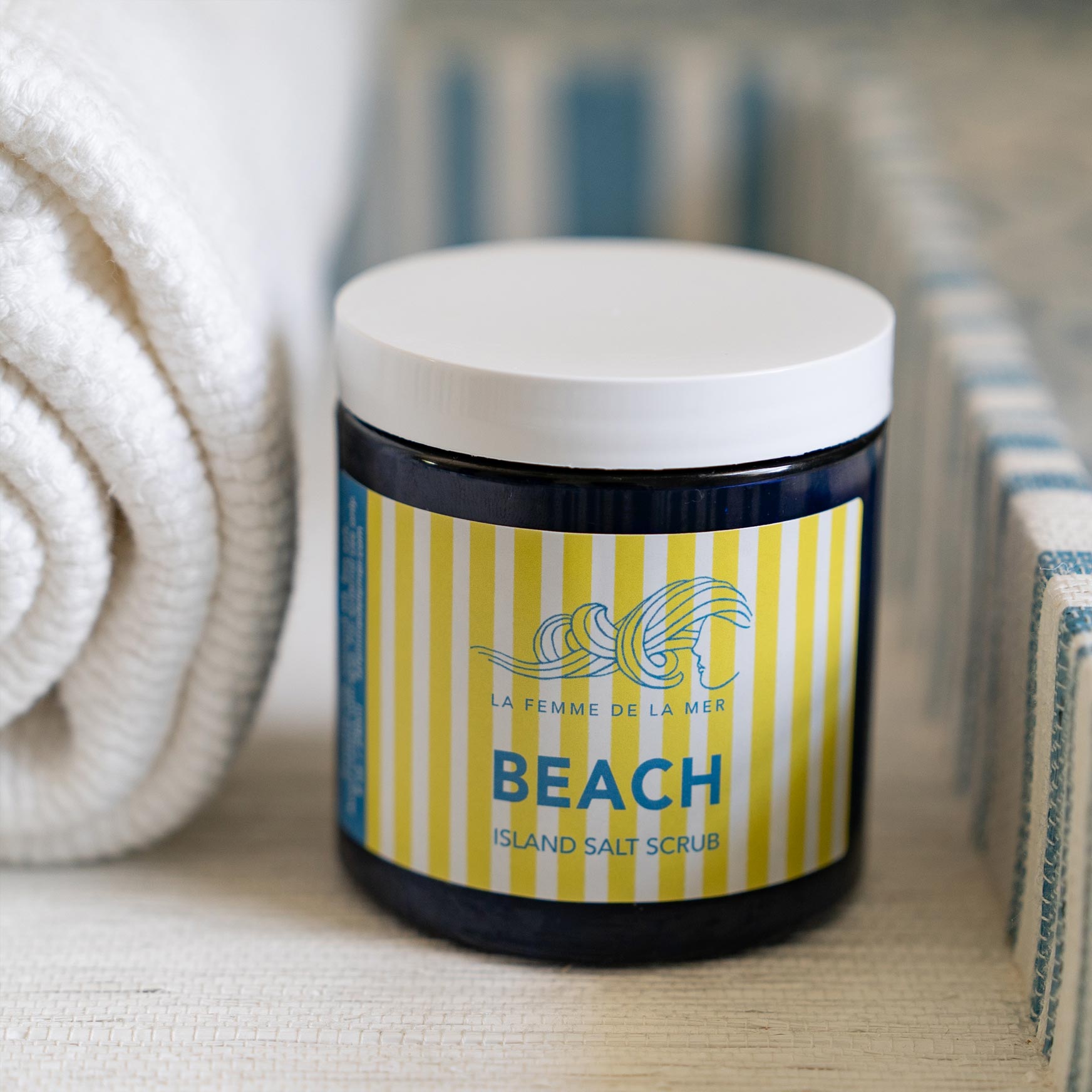 beach scent salt scrub container front white and yellow stripes label