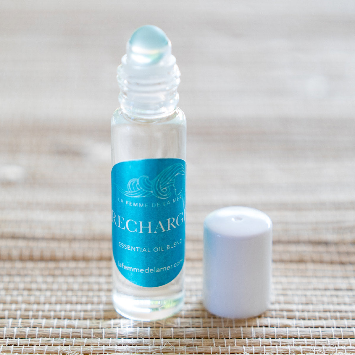 recharge essential oil roller small front 0.33 oz turquoise and white label