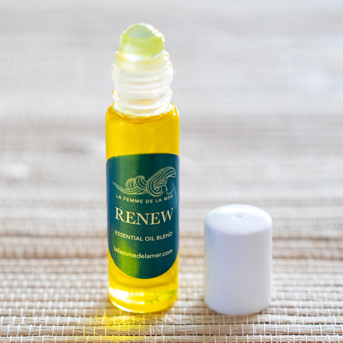 renew essential oil roller small front 0.33 oz green and white label